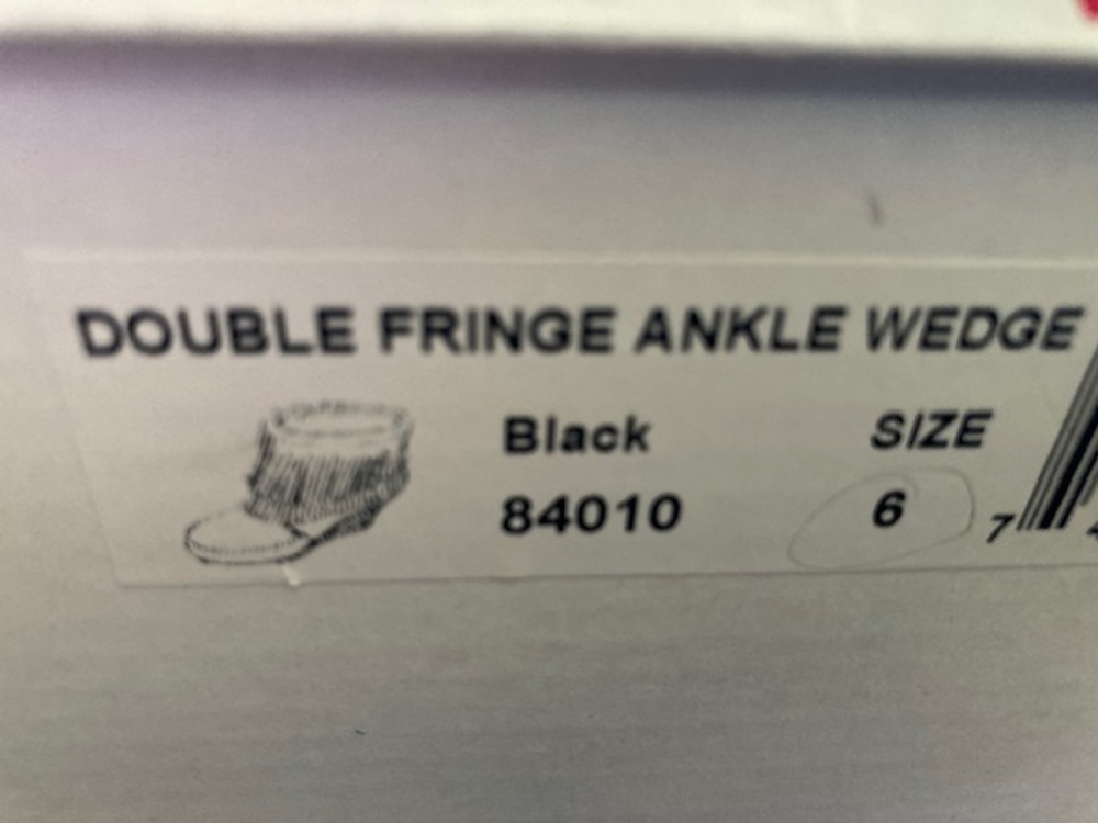 Minnetonka ankle boots with wedge heel in Black suede